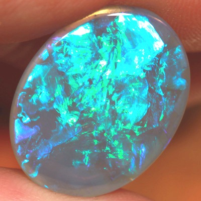 SOLID CRYSTAL OPAL Large opal 9cts! Peacock fire in alarge rolling flashes. Bright, clean colours. With VIDEO
